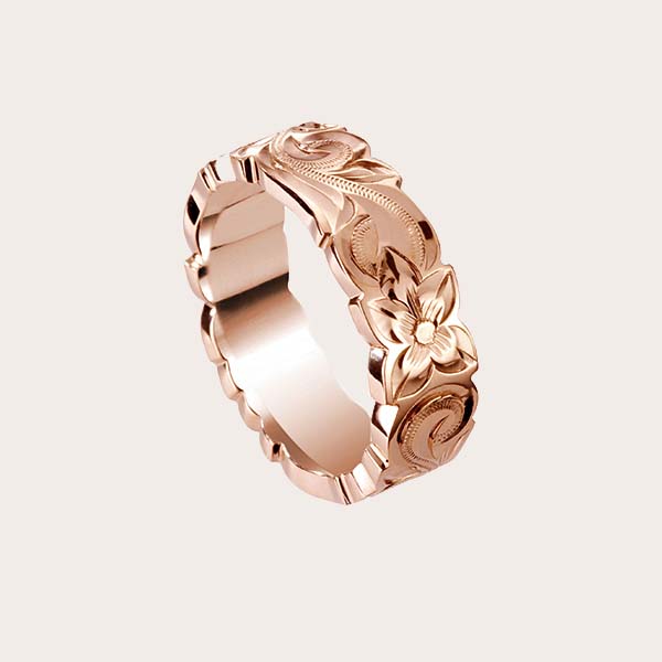 rose gold ring with hand engraved plumeria flower and Hawaiian scroll around