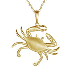 The picture shows a large 14K yellow gold blue crab pendant.