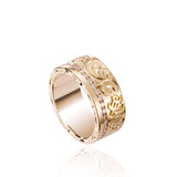 The picture shows a 14K yellow gold diamond Channel 8 mm ring with hand-engravings, including a sea turtle.