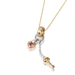 The picture shows a 14K yellow, rose, and white gold key and lock charm pendant with hand engravings.