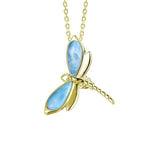 In this photo there is a yellow gold dragonfly pendant with blue larimar gemstones.