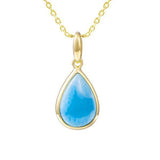 The photo shows a 14K yellow gold larimar teardrop pendant.
