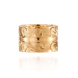 The picture shows a 14K yellow gold 12 mm ring with hand engravings.