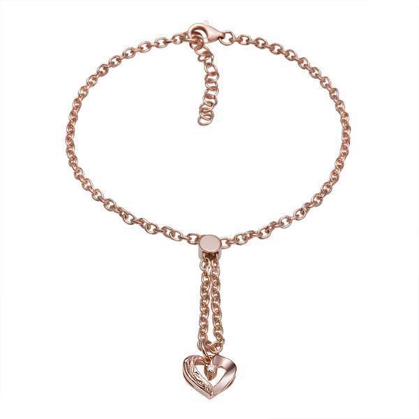 The picture shows a 14K rose gold heart bracelet with one diamond and hand-engravings.