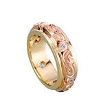 The picture shows a 14K yellow and rose gold two-tone infinity ring with diamonds and hand-engravings.