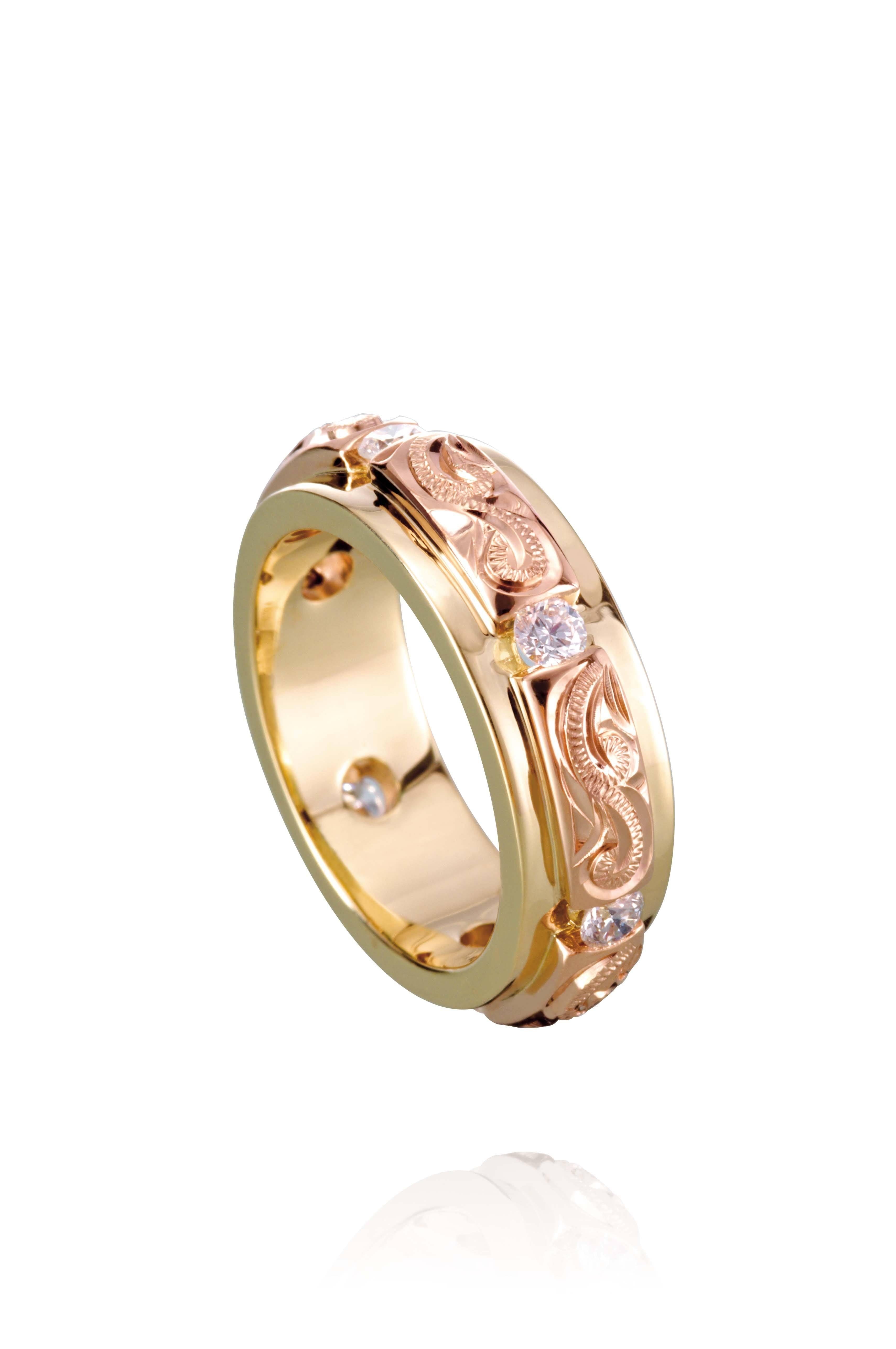 The picture shows a 14K yellow and rose gold two-tone infinity ring with diamonds and hand-engravings.