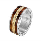 In this photo there is a white and yellow gold two-tone koa wood ring with scroll hand engravings.