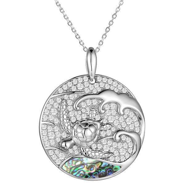 Sterling silver medallion pendant with a turtle swimming away from the abalone tides.