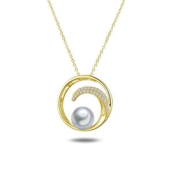In this photo there is a yellow gold circle pendant with a wave, diamonds, and one white Akoya pearl.