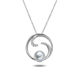In this photo there is a white gold circle pendant with diamonds and one white Akoya pearl.