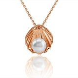 In this photo there is a rose gold oyster shell pendant with a white Akoya pearl.