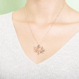 The picture shows a 925 sterling silver rose gold vermeil coral pendant.