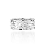 The picture shows a 925 sterling silver channel ring with hand engravings and diamonds.