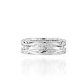 The picture shows a 925 sterling silver channel ring with hand engravings and diamonds.