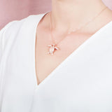 The picture shows a 925 sterling silver, rose gold plated, sea turtle pendant with topaz.