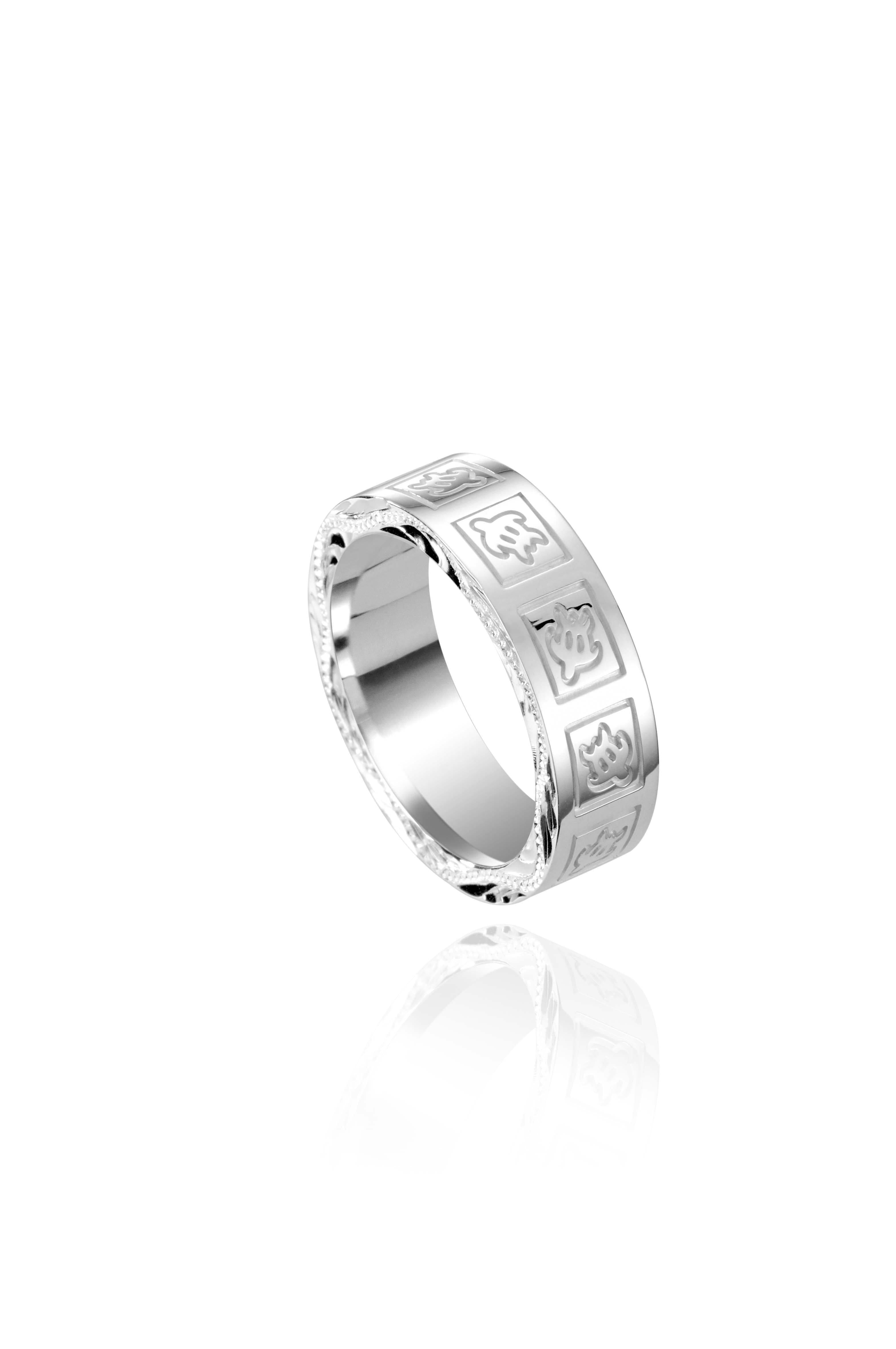 The picture shows a 925 sterling silver 6mm ring with hand engravings including sea turtles