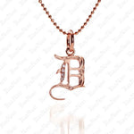 The picture shows a 14K rose gold Koa Nani D initial pendant.