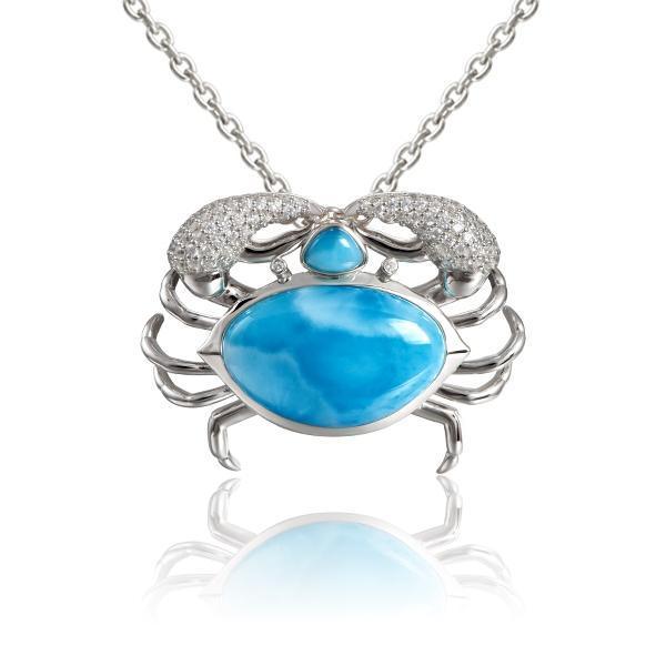 The picture shows a 925 sterling silver blue crab treasure pendant with hand-selected larimar gemstones and topaz.