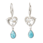 The photo shows a pair of larimar sterling silver earrings featuring our dolphin design.