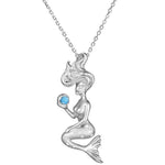 The picture shows a small 925 sterling silver larimar wishing mermaid pendant.