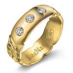 The picture shows a 14K yellow gold 6mm ring with hand engravings and diamonds.
