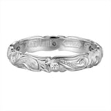The photo shows a 4mm platinum wave infinity band ring.