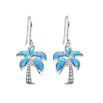 In this picture is a pair of palm tree dangle earrings with blue opalite and topaz gemstones set in sterling silver.