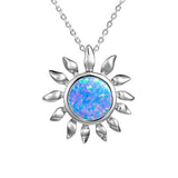 In this photo there is a sterling silver sunflower pendant with one blue opalite gemstone.