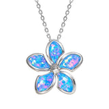 In this picture there is a plumeria pendant with blue opalite set in sterling silver.