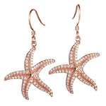 The picture shows a 14K rose gold pavé diamond starfish hook earrings.