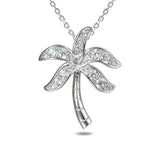 This photo shows a sterling silver palm tree pendant with topaz gemstones.