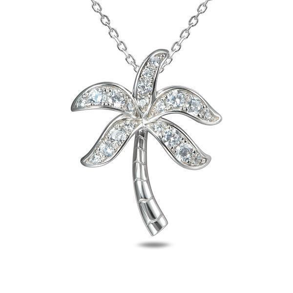 This photo shows a sterling silver palm tree pendant with topaz gemstones.