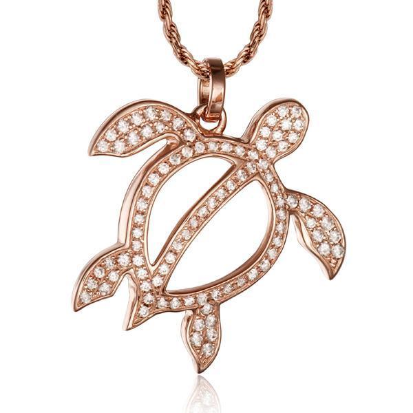 In this photo there is a rose gold sea turtle pendant with topaz gemstones.