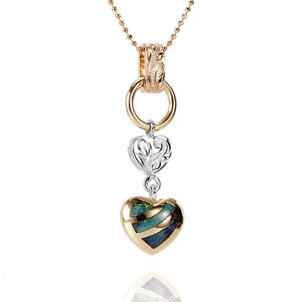 This picture shows a 14K yellow and white gold charm pendant featuring a heart motif paired with opal.