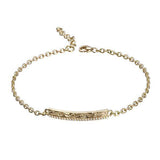 The picture shows a 14K yellow gold bar bracelet with diamonds and whale engraving.
