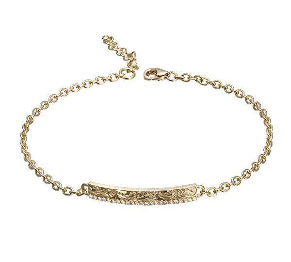 The picture shows a 14K yellow gold bar bracelet with diamonds and whale engraving.