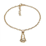 The picture shows a 14K yellow gold barrel bracelet with scroll engraving.