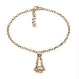 The picture shows a 14K yellow gold barrel bracelet with scroll engraving.