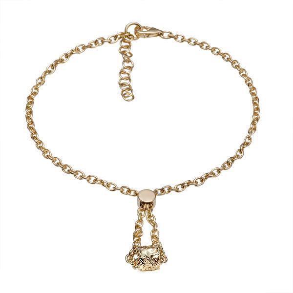 The picture shows a 14K yellow gold barrel bracelet with scroll engraving.