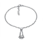 The picture shows a 14K white gold barrel bracelet with scroll engraving.