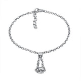 The picture shows a 14K white gold barrel bracelet with scroll engraving.