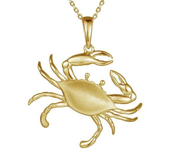 The picture shows a large 14K yellow gold blue crab pendant.