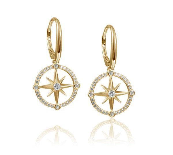 In this photo there is a pair of 14k yellow gold compass lever-back earrings with diamonds and aquamarine gemstones.