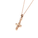 This image is of a 14K yellow gold cross charm with hand-engraved detailing.