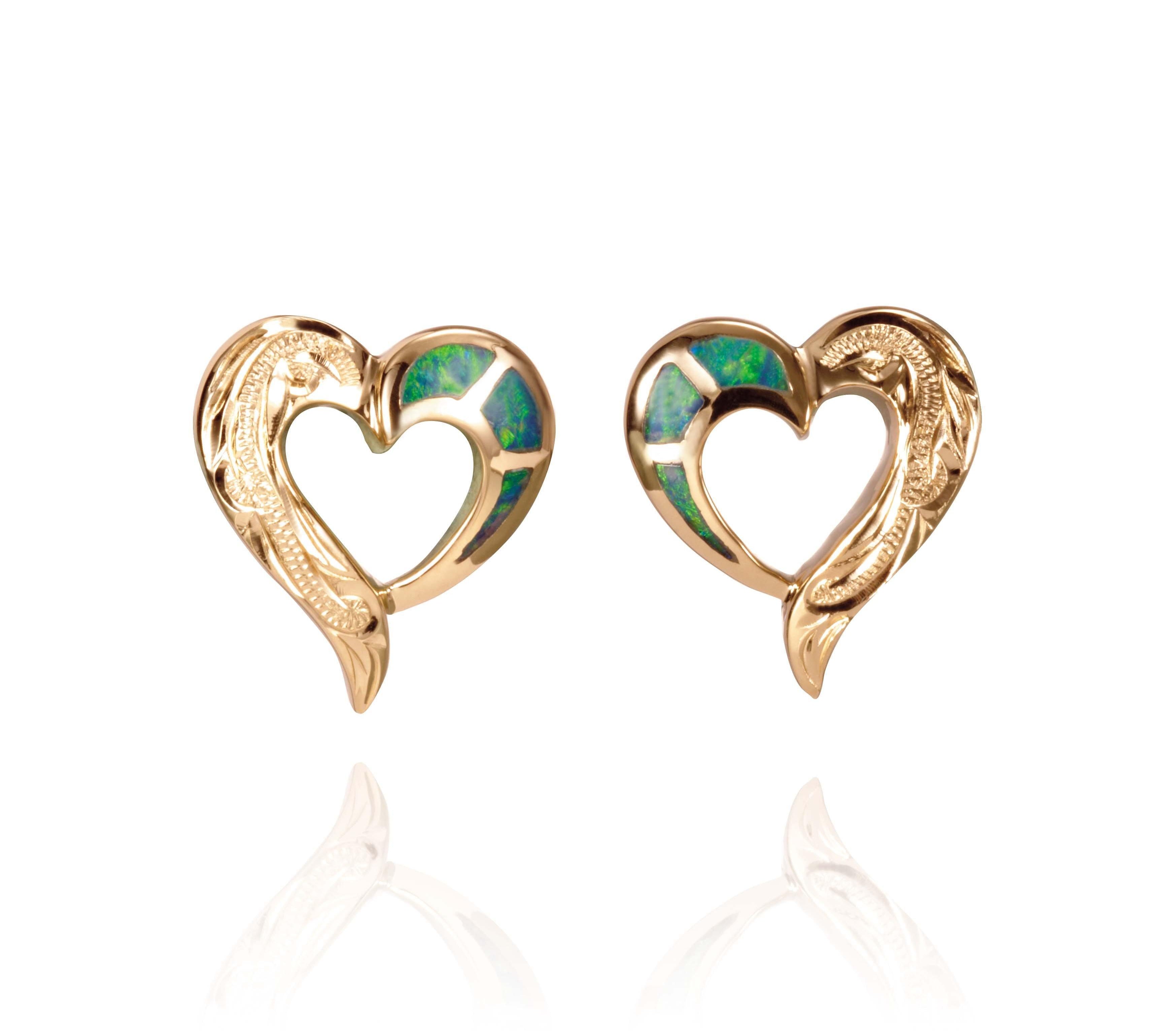 The picture shows a pair of 14K yellow gold hand-engraved Heart stud earrings with opal.