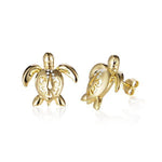The picture shows a pair of 14K yellow gold sea turtle stud earrings with a hibiscus flower cut-out design and diamonds.