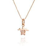 The picture shows a 14K rose gold sea turtle pendant.