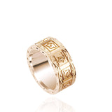 The picture shows a 14K yellow gold 8 mm ring with hand engravings including sea turtles.