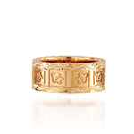 The picture shows a 14K yellow gold 8 mm ring with hand engravings including sea turtles.