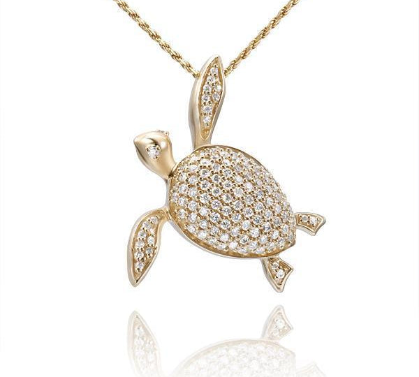 The picture shows a 14K yellow gold sea turtle pendant with diamonds.